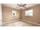 Neutral colored bedroom with 2 windows and a ceiling fan at 5300 Locksley Ave, Orlando, FL 32810