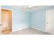 Light blue bedroom featuring a closet, light gray carpet, and neutral trim at 5300 Locksley Ave, Orlando, FL 32810