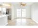 Bright dining area with tile floors, ceiling fan, and doors to the backyard at 5300 Locksley Ave, Orlando, FL 32810