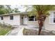 Charming single-story home featuring a well-maintained lawn, tidy landscaping, and a light beige exterior paint at 5300 Locksley Ave, Orlando, FL 32810