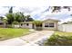 Charming single-story home featuring a well-maintained lawn, tidy landscaping, and a light beige exterior paint at 5300 Locksley Ave, Orlando, FL 32810