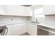 Kitchen featuring white cabinets, stainless steel appliances, and quartz countertops at 5300 Locksley Ave, Orlando, FL 32810