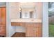 Bathroom featuring a vanity with storage and a large mirror at 5308 Pinebury Ct, Orlando, FL 32808