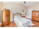Comfortable bedroom with vaulted ceiling, wood floors, and classic furnishings at 5308 Pinebury Ct, Orlando, FL 32808