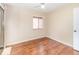Minimalist bedroom with wood floors, ceiling fan, and natural light at 5308 Pinebury Ct, Orlando, FL 32808