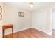 Neat bedroom with wood floors, a closet with folding doors, and a neutral color palette at 5308 Pinebury Ct, Orlando, FL 32808