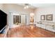Spacious living area with hardwood floors and a sliding glass door to the outside at 5308 Pinebury Ct, Orlando, FL 32808
