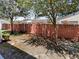 View of a backyard featuring a tall brick fence offering privacy and shade at 576 Prospect Pt, Oviedo, FL 32765