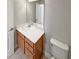 Bathroom vanity with a white countertop, light wood cabinets, and a mirror at 576 Prospect Pt, Oviedo, FL 32765