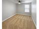 Cozy bedroom with plush carpeting, a ceiling fan, and a bright window at 576 Prospect Pt, Oviedo, FL 32765