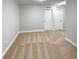 Neutral bedroom features neutral carpet, two doors, and recessed lighting at 576 Prospect Pt, Oviedo, FL 32765