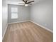 Bright bedroom with neutral carpet and large window with blinds at 576 Prospect Pt, Oviedo, FL 32765