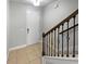 Welcoming foyer features tile flooring, and staircase with decorative wrought iron railing at 576 Prospect Pt, Oviedo, FL 32765