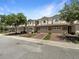Charming townhome exterior with well-maintained landscaping, brick driveway, and attached one car garage at 576 Prospect Pt, Oviedo, FL 32765