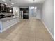 Open concept kitchen boasts a granite island and stainless steel appliances at 576 Prospect Pt, Oviedo, FL 32765