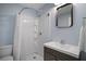 Cozy bathroom with a shower, vanity and mirror at 716 N Rockingham Ave, Tavares, FL 32778