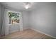 Bright bedroom with natural light from a large window overlooking the backyard at 716 N Rockingham Ave, Tavares, FL 32778