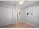 Neutral bedroom with bright windows and a closet at 716 N Rockingham Ave, Tavares, FL 32778