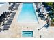 Aerial view of community pool, spa, and lounge areas, designed for relaxation and enjoyment at 7478 Brooklyn Dr, Kissimmee, FL 34747