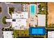 An aerial view showing a community pool, tennis court, volleyball court, and clubhouse at 7478 Brooklyn Dr, Kissimmee, FL 34747