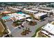 Overhead view of a modern complex with beautiful landscaping, clubhouse, and recreation areas at 7478 Brooklyn Dr, Kissimmee, FL 34747