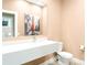 Modern half-bath featuring a sleek vanity, contemporary fixtures, and stylish decor at 7478 Brooklyn Dr, Kissimmee, FL 34747