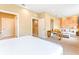 Spacious bedroom featuring a sitting area, neutral decor and carpet at 7478 Brooklyn Dr, Kissimmee, FL 34747