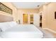 Bedroom with a neutral color palette and adjoining bathroom and closet at 7478 Brooklyn Dr, Kissimmee, FL 34747