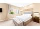 Relaxing bedroom with a king bed, window view and soft, neutral color scheme at 7478 Brooklyn Dr, Kissimmee, FL 34747