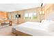 Comfortable bedroom featuring king bed, ample natural light and carpet at 7478 Brooklyn Dr, Kissimmee, FL 34747