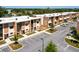 Modern townhouse exteriors with parking, landscaping, and clean architectural lines at 7478 Brooklyn Dr, Kissimmee, FL 34747