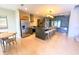 Modern kitchen with stainless steel appliances, dark wood cabinetry, and a large island at 7478 Brooklyn Dr, Kissimmee, FL 34747