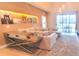Cozy living room with modern decor and a view of the outdoor space at 7478 Brooklyn Dr, Kissimmee, FL 34747