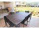 Stylish outdoor kitchen featuring a grill, countertop, and spacious dining area for entertaining at 7478 Brooklyn Dr, Kissimmee, FL 34747