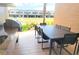 Inviting outdoor kitchen with built-in grill, dining area, and views of the landscaped grounds at 7478 Brooklyn Dr, Kissimmee, FL 34747