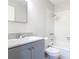 Updated bathroom with a gray vanity, white tiling in shower and tub, and modern fixtures at 809 Sugar House Blvd, Port Orange, FL 32129