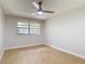 Bedroom featuring wood-look floors, a ceiling fan, and a window with blinds at 809 Sugar House Blvd, Port Orange, FL 32129