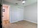 Bedroom showcasing bi-fold closet doors and wood-look floors at 809 Sugar House Blvd, Port Orange, FL 32129