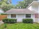 An aerial view of a quaint single-story home featuring well-maintained landscaping, and a concrete driveway at 809 Sugar House Blvd, Port Orange, FL 32129