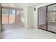 Enclosed porch with tile floor, windows, and sliding glass door to the interior at 809 Sugar House Blvd, Port Orange, FL 32129