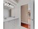 Bathroom with double vanity, bright lighting, and tile flooring at 875 Bentley Green Cir, Winter Springs, FL 32708