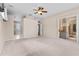 Large bedroom with a ceiling fan and a sliding glass door to the lanai at 875 Bentley Green Cir, Winter Springs, FL 32708
