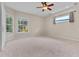 Spacious bedroom with a ceiling fan and bright windows, providing plenty of natural light at 875 Bentley Green Cir, Winter Springs, FL 32708
