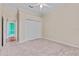 Bedroom with carpet floors, double door closet, and bright overhead fan at 875 Bentley Green Cir, Winter Springs, FL 32708