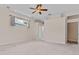 Bright bedroom with a ceiling fan and a window showcasing the exterior at 875 Bentley Green Cir, Winter Springs, FL 32708