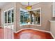 Bright breakfast nook offering views of the outdoor pool and patio area through a bay window at 875 Bentley Green Cir, Winter Springs, FL 32708