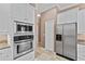 Kitchen showcasing stainless steel appliances and ample cabinet space for all your storage needs at 875 Bentley Green Cir, Winter Springs, FL 32708
