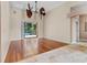 Spacious living room features wood floors, a ceiling fan, and sliding glass doors to the pool at 875 Bentley Green Cir, Winter Springs, FL 32708