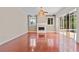 Open living area with fireplace, ceiling fan and sliding glass doors leading to the outdoor lanai at 875 Bentley Green Cir, Winter Springs, FL 32708
