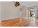 Bright living room with wood floors and an open layout flows seamlessly into the home's entrance at 875 Bentley Green Cir, Winter Springs, FL 32708